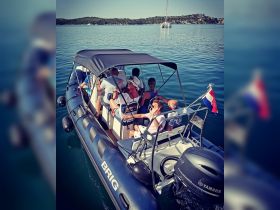 A lively group enjoys a day on the water aboard a BRIG boat, perfect for exploring scenic destinations and creating unforgettable memories.