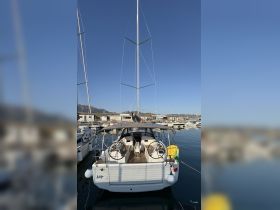 A stunning view of a yacht docked at the marina, showcasing its sleek design and well-maintained exterior, perfect for sailing enthusiasts.