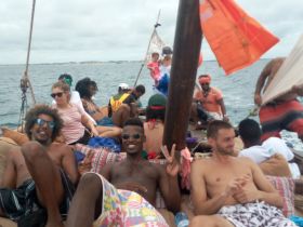 A lively group enjoys a fun day on the water, relaxing and celebrating aboard a boat — perfect for social gatherings and memorable experiences.