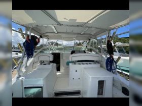 Interior view of a boat's helm and seating area, showcasing a clean and spacious design ideal for comfortable cruising.
