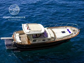 A stunning aerial view of a luxurious yacht cruising through deep blue waters, perfect for exploring coastal destinations or enjoying a day at sea.