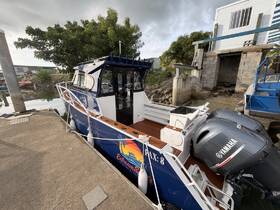 A detailed view of a well-maintained boat docked at the marina, showcasing its sleek design and features, perfect for fishing or leisure trips.