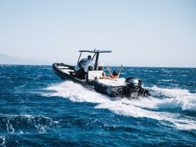 A lively scene aboard a speedboat with guests enjoying the ride, showcasing the thrill of on-water adventures.