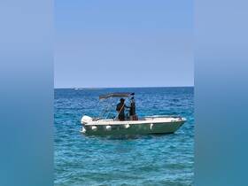 A sleek speedboat navigates through crystal-clear waters, showcasing the perfect day for boating adventures.