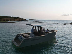 A group enjoys a scenic ride on a 100% electric boat, showcasing eco-friendly boating in beautiful waters.