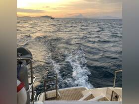 A serene view from the back of a boat, showcasing the wake and a beautiful sunset over the water — perfect for capturing the essence of a peaceful evening cruise.