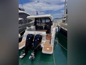 A sleek view of the 'Blue Whisper' yacht docked, showcasing its modern design and twin engines — perfect for luxury boating experiences.