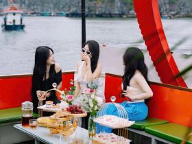 A joyful gathering of friends enjoying refreshments and laughter aboard a boat, perfect for celebrations and memorable outings on the water.