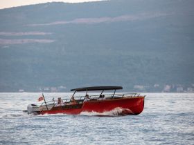 A lively group enjoys a boat ride on the water, showcasing the fun and excitement of on-water activities with friends.