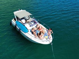 A lively group enjoys a day on the water aboard a Blackfin boat, soaking up the sun and creating unforgettable memories with friends.