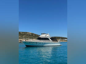 A stunning yacht anchored in crystal-clear waters, showcasing its sleek design against a backdrop of serene coastal scenery.