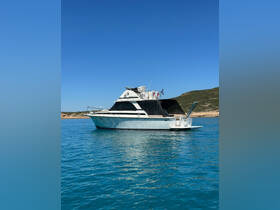 A stunning yacht glides through crystal-clear waters, showcasing its elegant design against a backdrop of serene blue skies — perfect for luxury boating adventures.