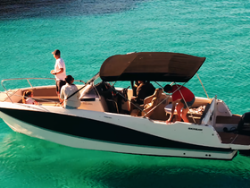A lively group enjoys a day on the water aboard a boat, surrounded by stunning turquoise waters — perfect for family outings and aquatic adventures.