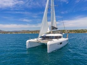 A stunning view of a sleek catamaran sailing through clear blue waters, perfect for exploring coastal destinations.