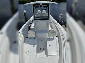 A clean and spacious interior view of a boat's helm and seating area, showcasing the modern design and functionality ideal for comfortable navigation.