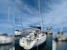 A beautiful Oceanis 31 yacht docked in a marina, showcasing its sleek design against a clear blue sky — perfect for sailing enthusiasts.