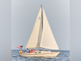 A group enjoys a sailing adventure on a beautiful day, showcasing the joy of being on the water aboard a classic sailboat.