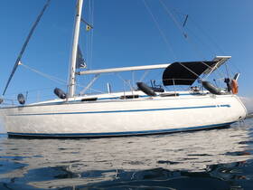 A stunning side view of a Bavaria sailboat gliding through calm waters under a clear blue sky, showcasing its sleek design and elegance.