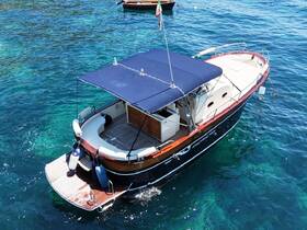 A stunning aerial view of a beautifully designed boat docked in crystal-clear waters, perfect for exploring coastal destinations.