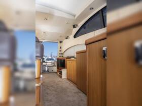 A well-appointed interior view of a boat's cabin, showcasing comfortable seating and modern amenities, perfect for relaxing on the water.