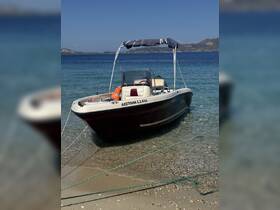 A beautiful boat named 'ΔΕΣΠΟΙΝΑ' docked on a sandy beach, surrounded by clear waters — perfect for a day of exploration and relaxation.