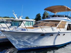 A stunning view of a yacht docked at the marina, showcasing its sleek design and elegant features against a clear blue sky.