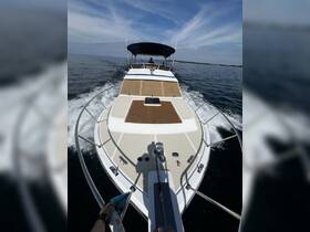 A stunning view of a yacht cruising through calm waters, showcasing its sleek design and spacious deck — perfect for a day on the water.
