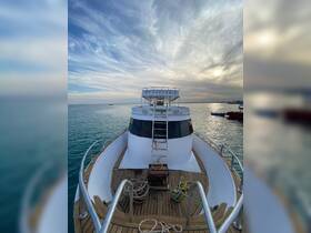 A stunning view of the bow of a boat named 'Pesypowe' against a serene backdrop of water and clouds, perfect for showcasing the vessel's design and structure.