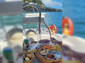 A delightful spread of snacks and fruits is prepared on board, perfect for enjoying while sailing in beautiful waters.