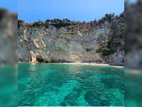 A stunning view of a rocky coastline with clear turquoise waters, perfect for exploring the natural beauty of the area.