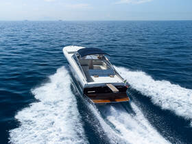 A sleek speedboat glides through the open water, showcasing its elegant design and powerful performance — perfect for thrilling adventures on the sea.