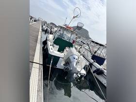 A detailed view of a speedboat docked at the marina, showcasing its sleek design and fishing gear, perfect for water adventures.