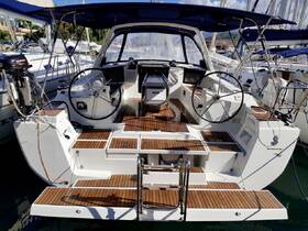 A detailed view of the helm and interior of a Beneteau sailboat, showcasing its modern design and functional layout, perfect for sailing enthusiasts.