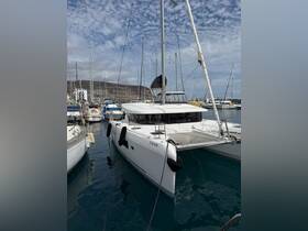 A stunning catamaran docked in a marina, showcasing its sleek design and vibrant surroundings — perfect for sailing adventures.