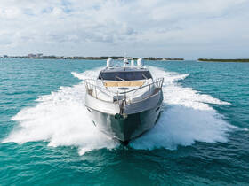 A stunning yacht cuts through the turquoise waters, showcasing its sleek design and elegance while underway — perfect for luxury charters and coastal adventures.