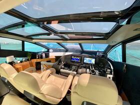 A spacious and modern helm area inside a luxury yacht, featuring comfortable seating and advanced navigation equipment, perfect for a smooth sailing experience.