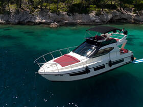 A stunning aerial view of a luxurious yacht cruising through crystal-clear turquoise waters, perfect for summer adventures and island hopping.