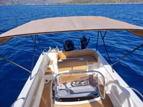 A well-appointed helm area of a boat featuring comfortable seating and a clear view of the water, perfect for navigating scenic waters.