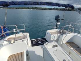 A view of the helm area inside a boat, showcasing the console and seating, perfect for navigating the waters in comfort.
