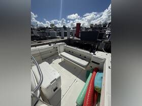Interior view of a boat showcasing the seating and helm area, perfect for a day out on the water.