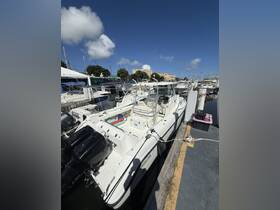 A sleek speedboat docked at the marina, showcasing its modern design and ready for adventure on the water.