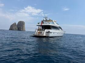 A luxurious yacht cruising near iconic rock formations, showcasing the perfect blend of elegance and adventure on the water.
