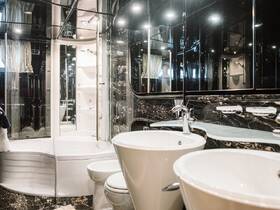 A luxurious boat bathroom featuring modern fixtures and elegant design, perfect for onboard comfort and convenience.