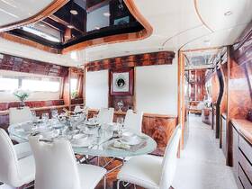 Elegant interior of a yacht's dining area featuring a beautifully set table, perfect for luxurious dining experiences on the water.
