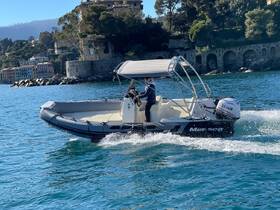 A speedboat navigates through clear waters, showcasing the beautiful coastal scenery — perfect for exploring picturesque destinations.
