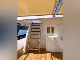 A well-designed interior view showcasing the staircase and storage area on a yacht, perfect for accessing upper decks and maximizing space.