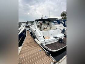 A sleek boat docked at the marina, showcasing its elegant design and surroundings — perfect for a day on the water.