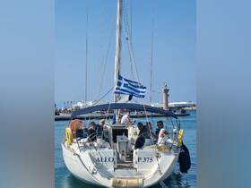 A lively group enjoys a day on a sailboat in Greece, showcasing the perfect blend of relaxation and adventure on the water.