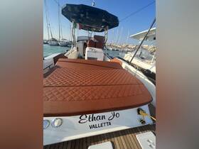 Interior view of the luxurious seating area on the 'Ethan Jo' boat, showcasing a comfortable and stylish design ideal for relaxing on the water.