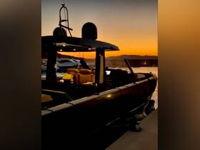 A sleek boat docked at sunset, showcasing its elegant design against a vibrant sky — perfect for evening cruises or relaxation on the water.